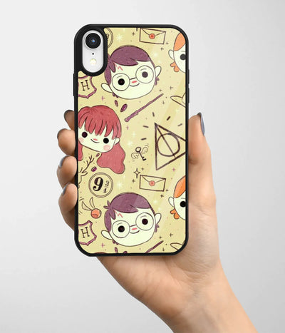 A hand holding a glass phone case with a colorful design.