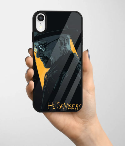 A hand holding a glass phone case with a colorful design.