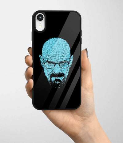 A hand holding a glass phone case with a colorful design.