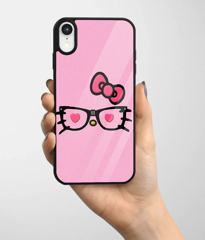 A hand holding a glass phone case with a colorful design.