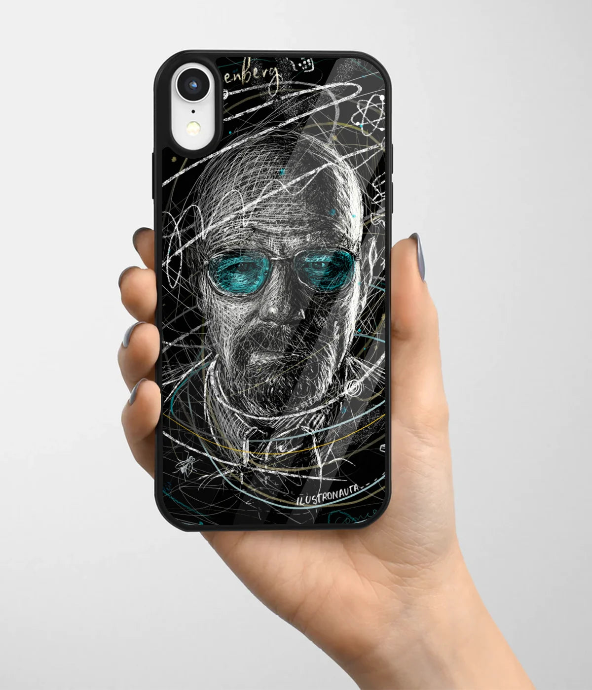 A hand holding a glass phone case with a colorful design.