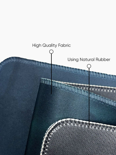 Close-up of high-quality fabric desk mat with natural rubber usage, showing texture and stitching details.