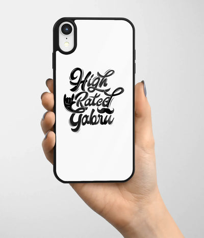 A hand holding a glass phone case with a colorful design.