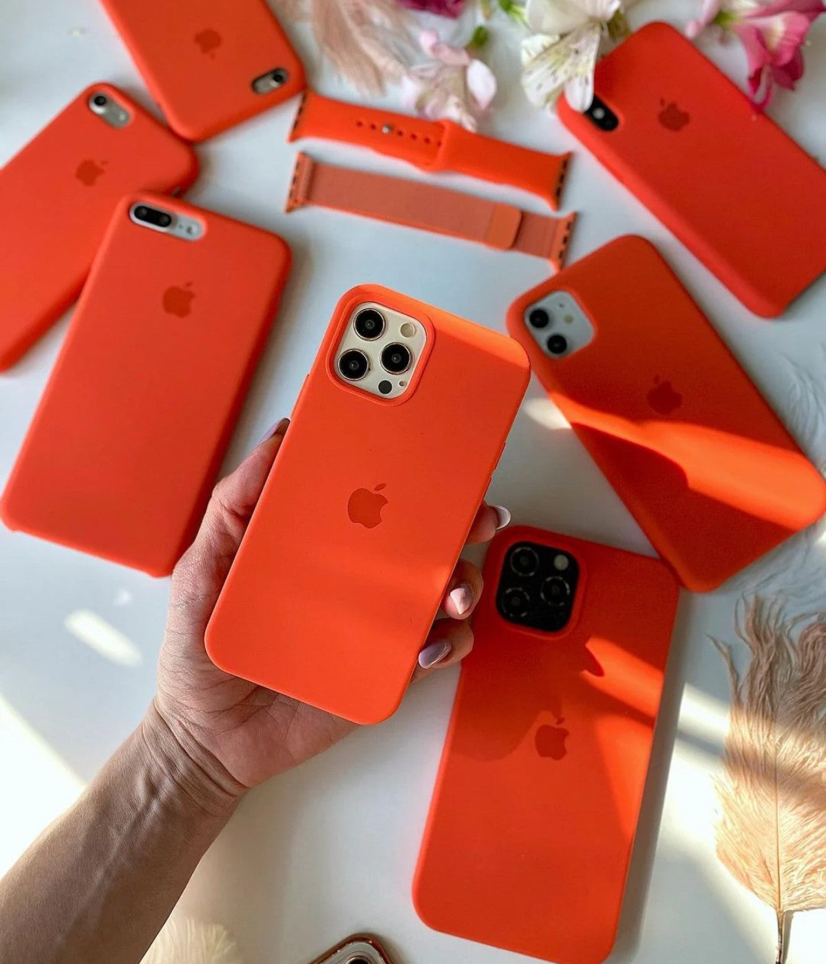 A orange liquid silicone case for the iPhone.