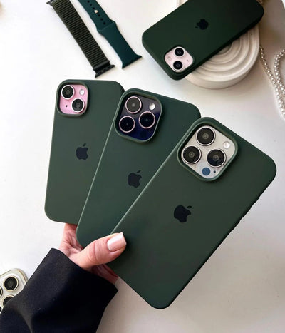 Multiple cyprus green iPhone silicone cases on a white surface.