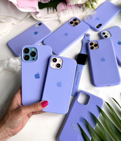 Multiple lilac iPhone silicone cases on a white background.