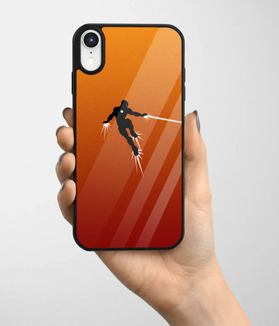 A hand holding a glass phone case with a colorful design.