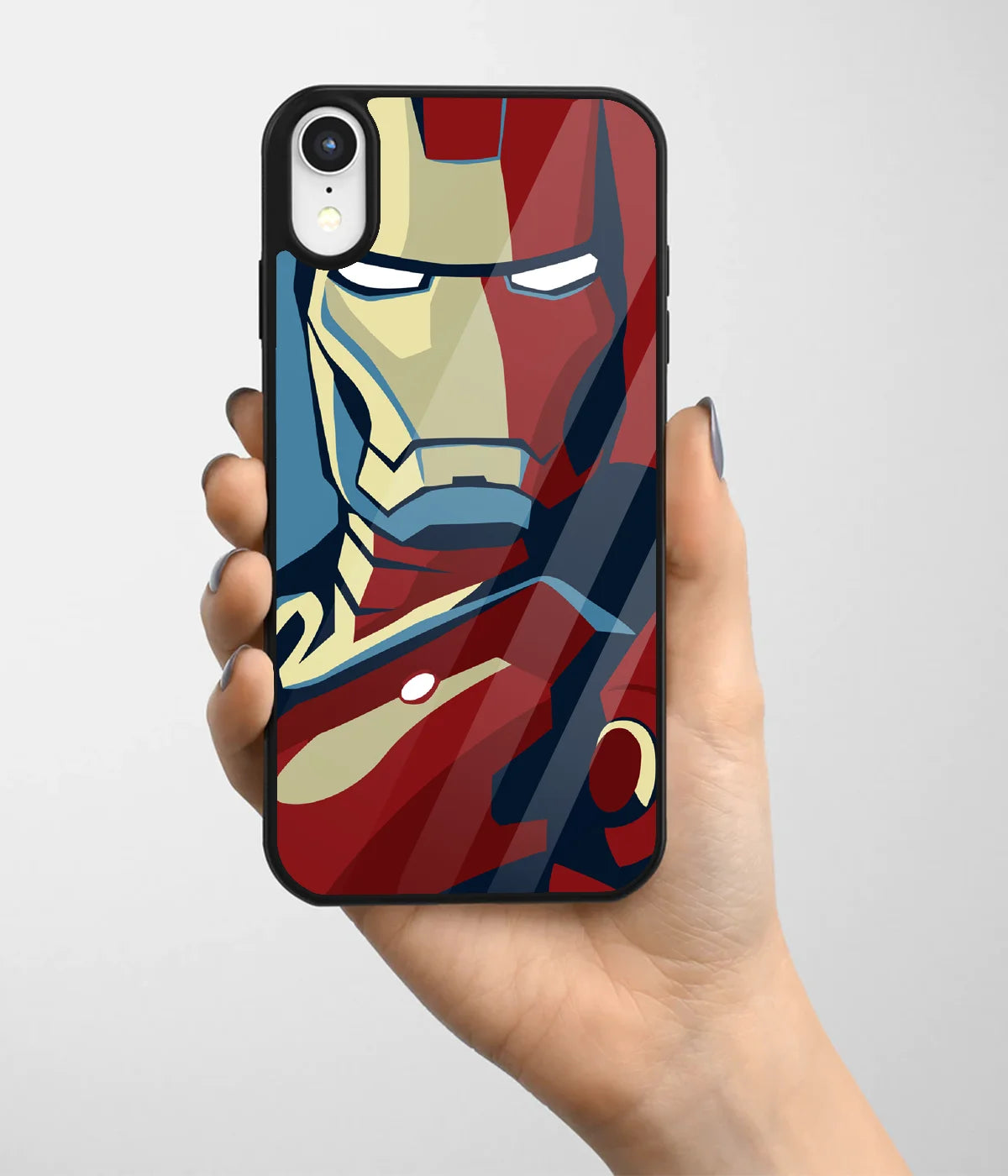 A hand holding a glass phone case with a colorful design.