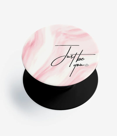 A top-down view of a phone grip holder on a clean white background