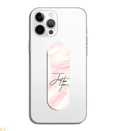 A phone grip slider applied to the back of a smartphone.