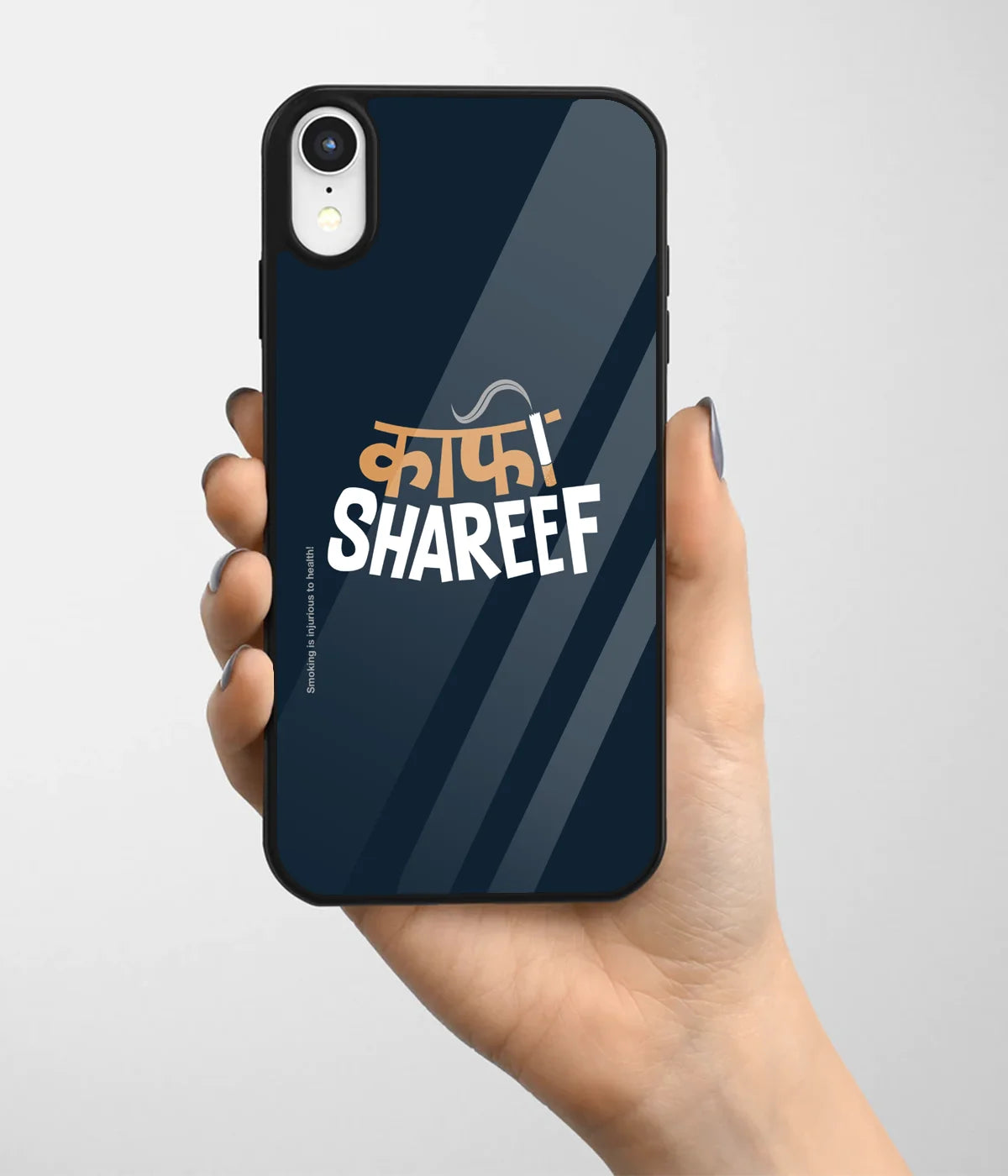 A hand holding a glass phone case with a colorful design.