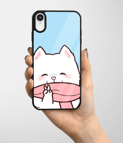 A hand holding a glass phone case with a colorful design.