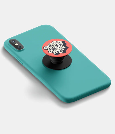 A top-down view of a phone grip holder attached to a mobile phone case on a white background