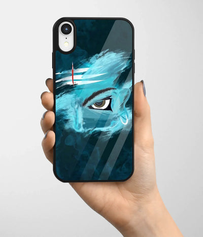 A hand holding a glass phone case with a colorful design.