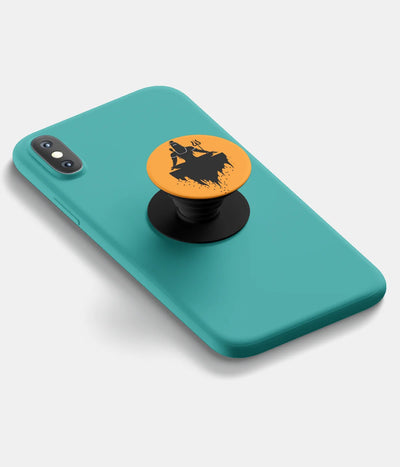 A top-down view of a phone grip holder attached to a mobile phone case on a white background