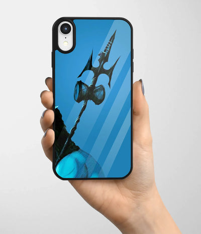 A hand holding a glass phone case with a colorful design.