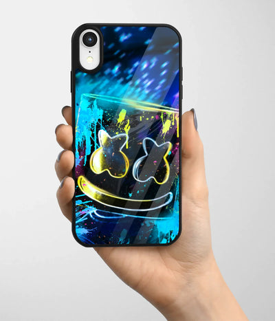 A hand holding a glass phone case with a colorful design.