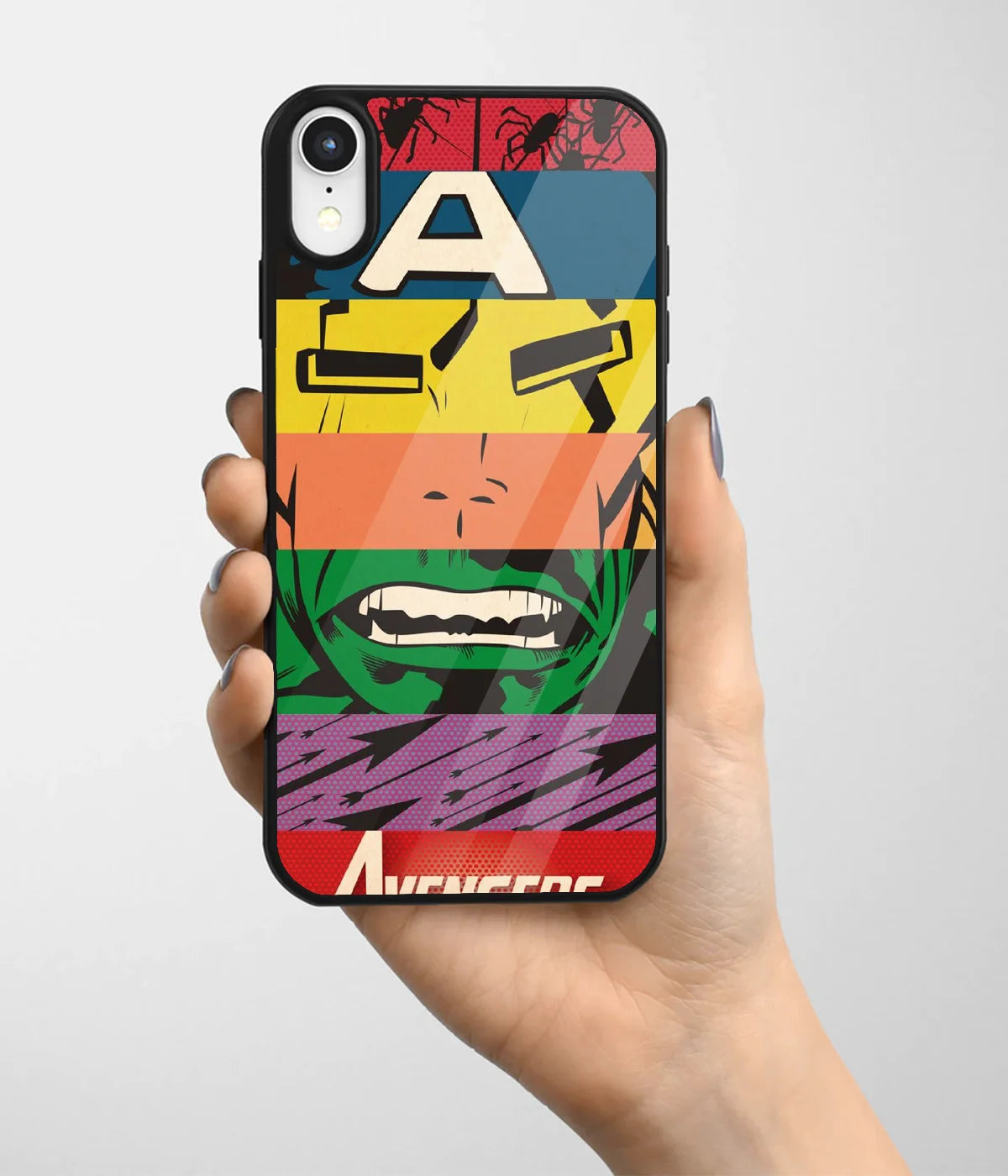 A hand holding a glass phone case with a colorful design.