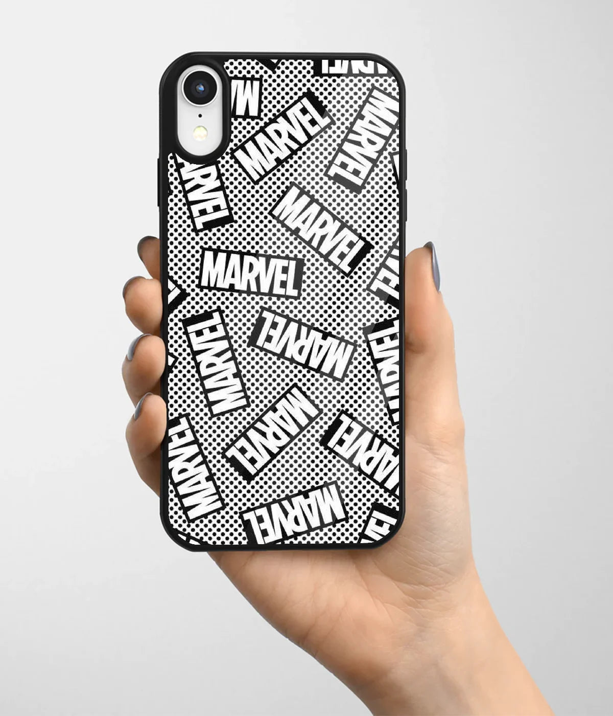 A hand holding a glass phone case with a colorful design.