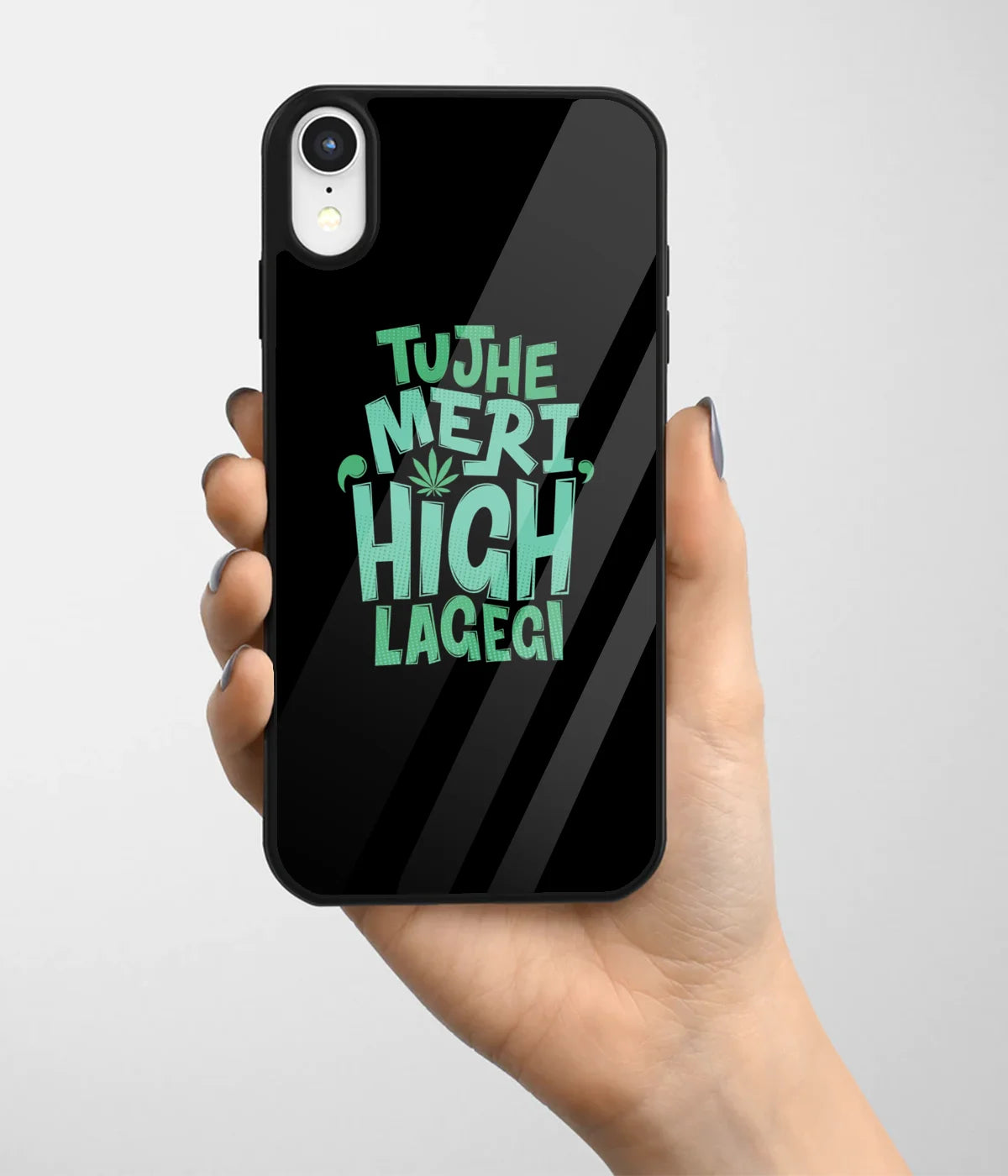 A hand holding a glass phone case with a colorful design.