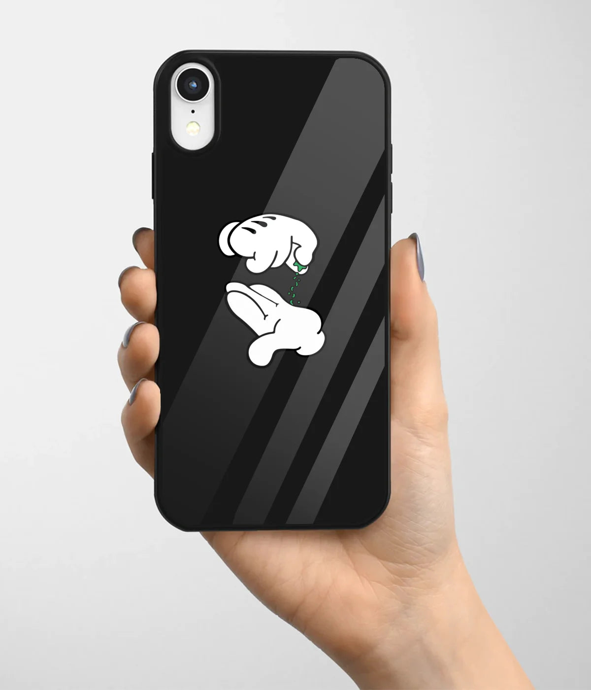A hand holding a glass phone case with a colorful design.