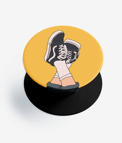 A top-down view of a phone grip holder on a clean white background