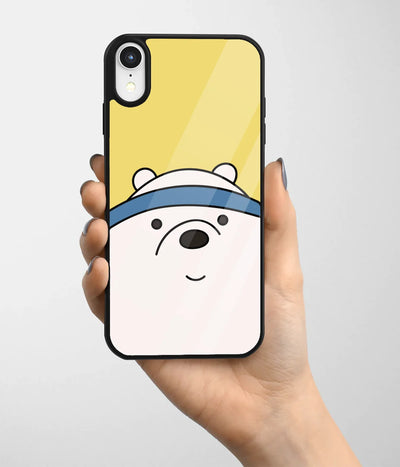 A hand holding a glass phone case with a colorful design.