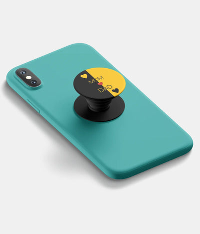 A top-down view of a phone grip holder attached to a mobile phone case on a white background