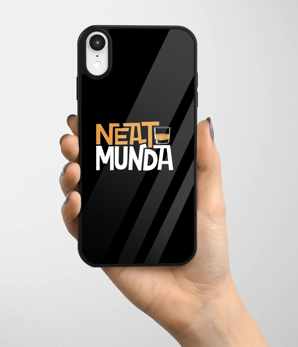 A hand holding a glass phone case with a colorful design.