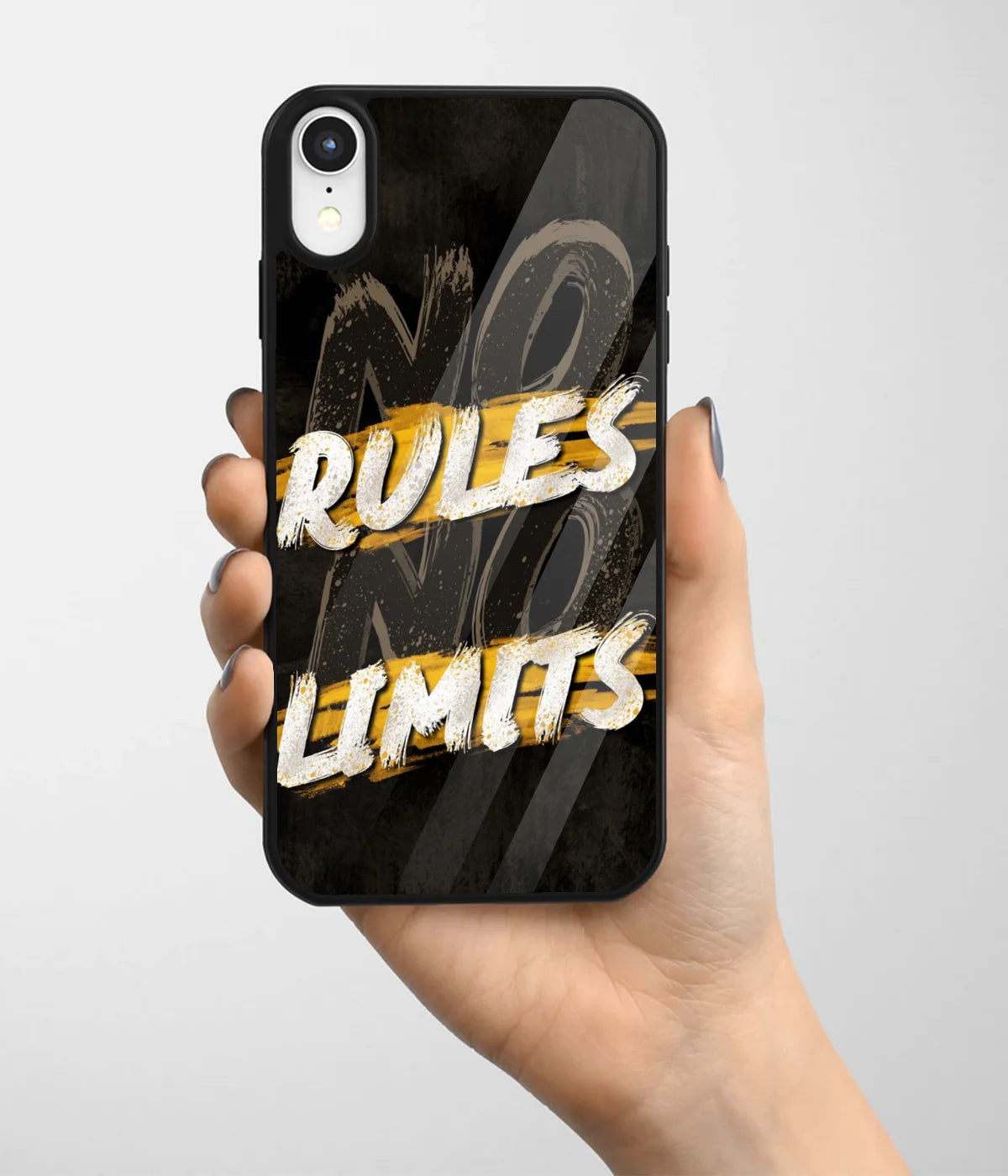 A hand holding a glass phone case with a colorful design.