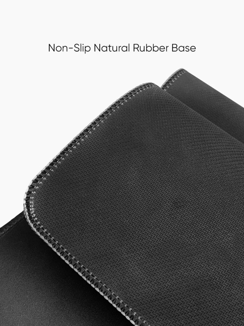 Close-up view of the non-slip natural rubber base desk mat that stays securely in place on any surface.