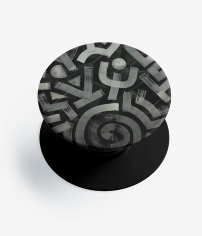A top-down view of a phone grip holder on a clean white background