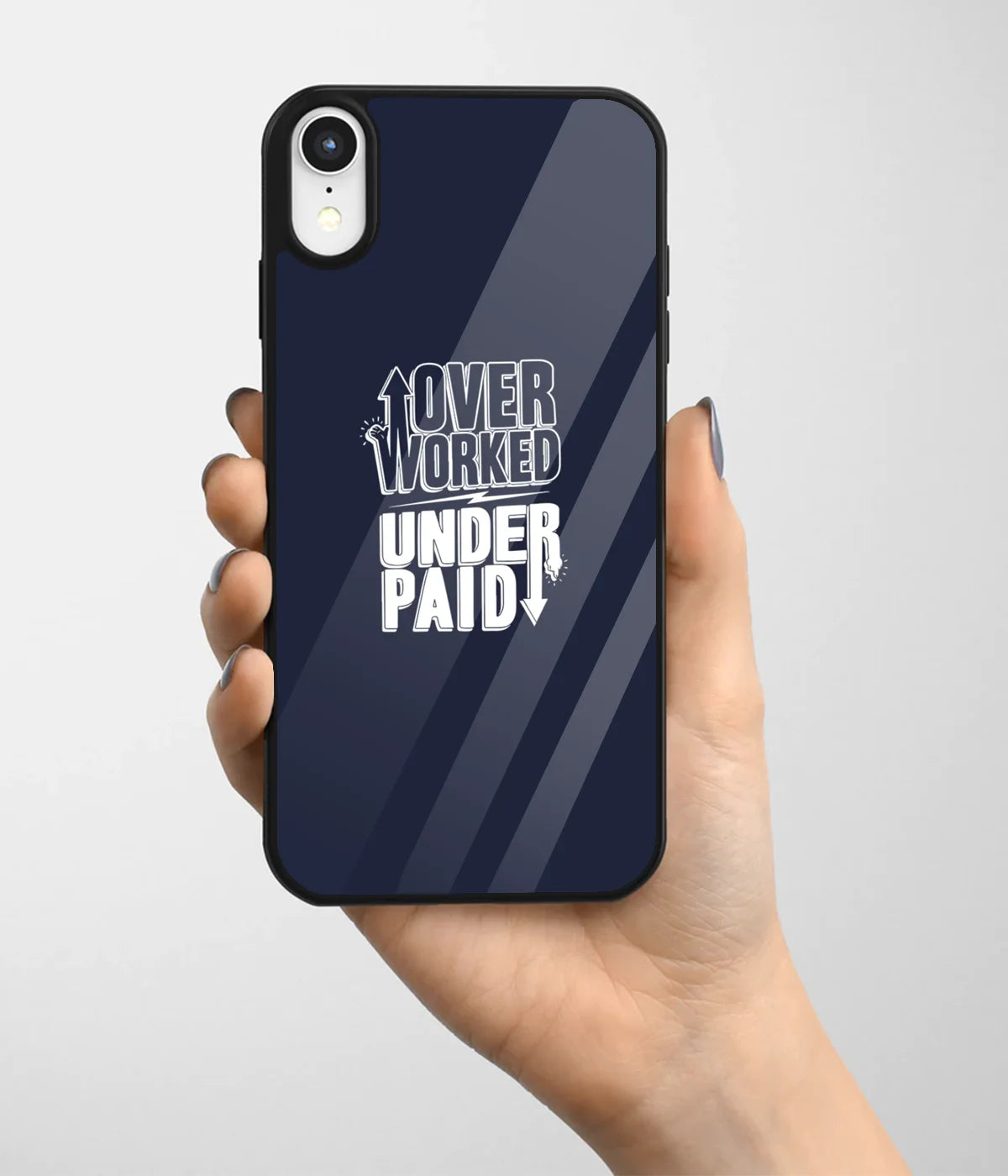 A hand holding a glass phone case with a colorful design.