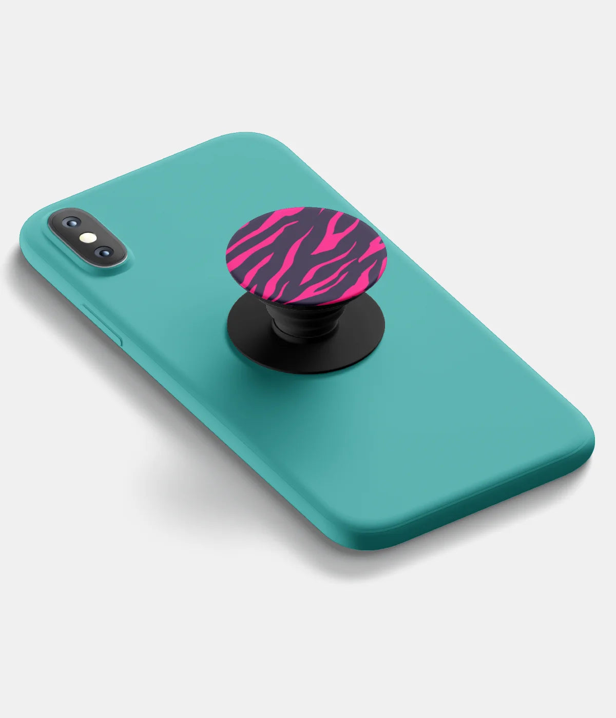 A top-down view of a phone grip holder attached to a mobile phone case on a white background
