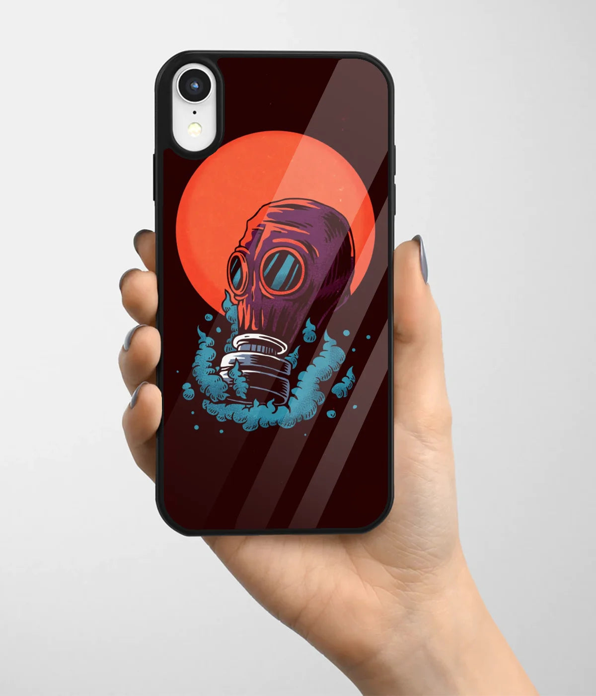 A hand holding a glass phone case with a colorful design.