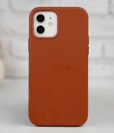 Full back view of an iPhone protected by the premium brown leather case, featuring a sleek design and an embossed Apple logo.