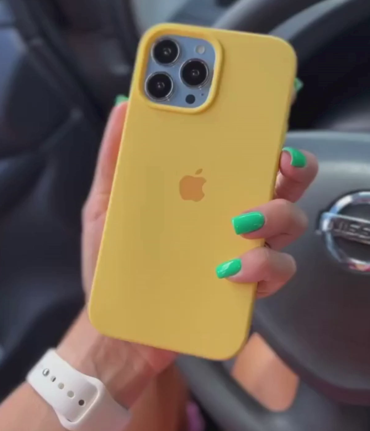 A video showing a 360-degree view and a close-up of the iPhone yellow liquid silicone case