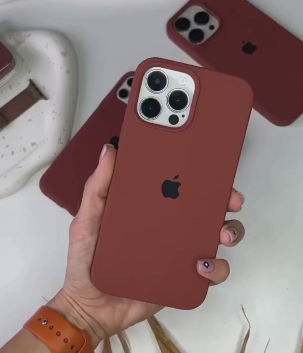 Load video: A video showing a 360-degree view and a close-up of the iPhone brown liquid silicone case