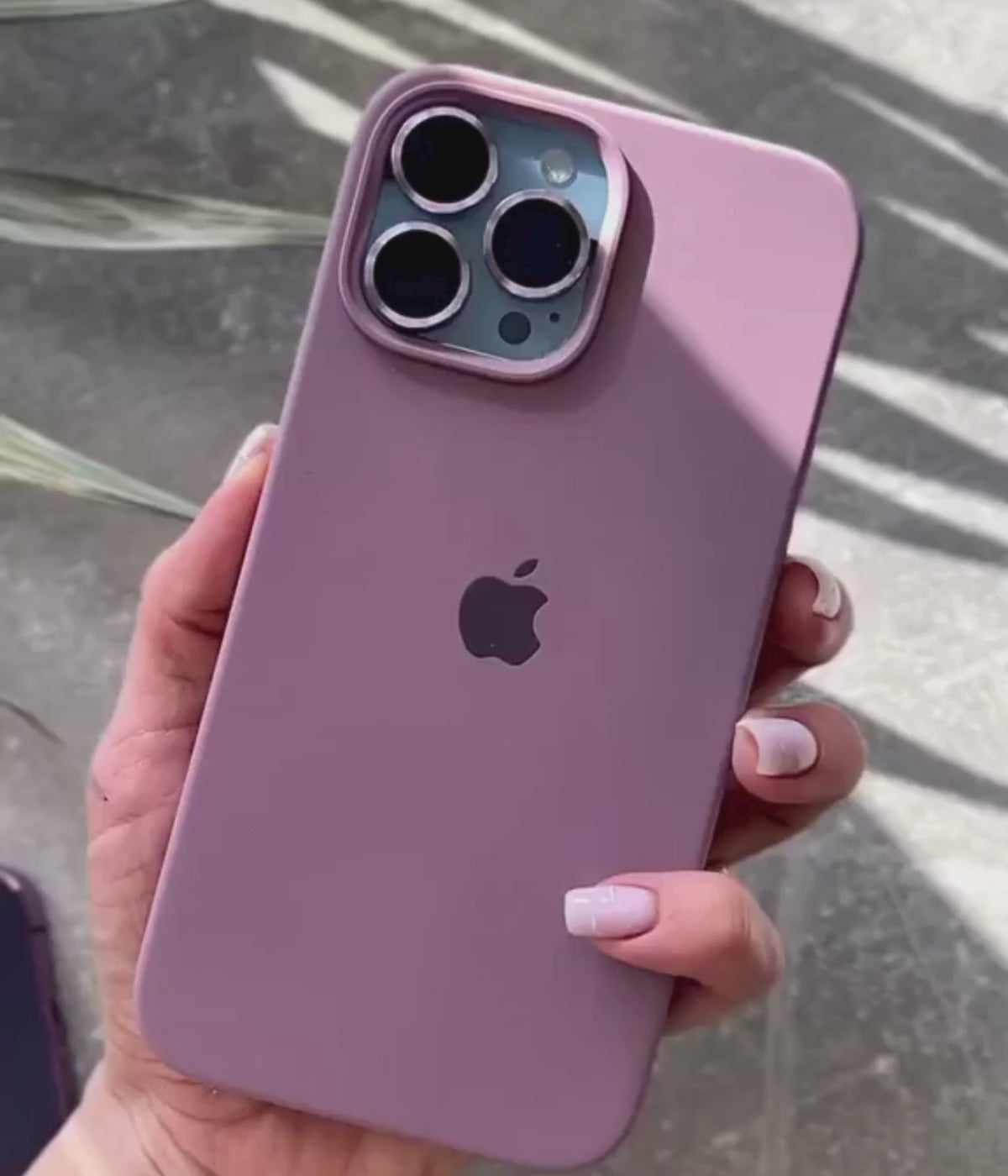 Load video: A video showing a 360-degree view and a close-up of the iPhone black currant liquid silicone case