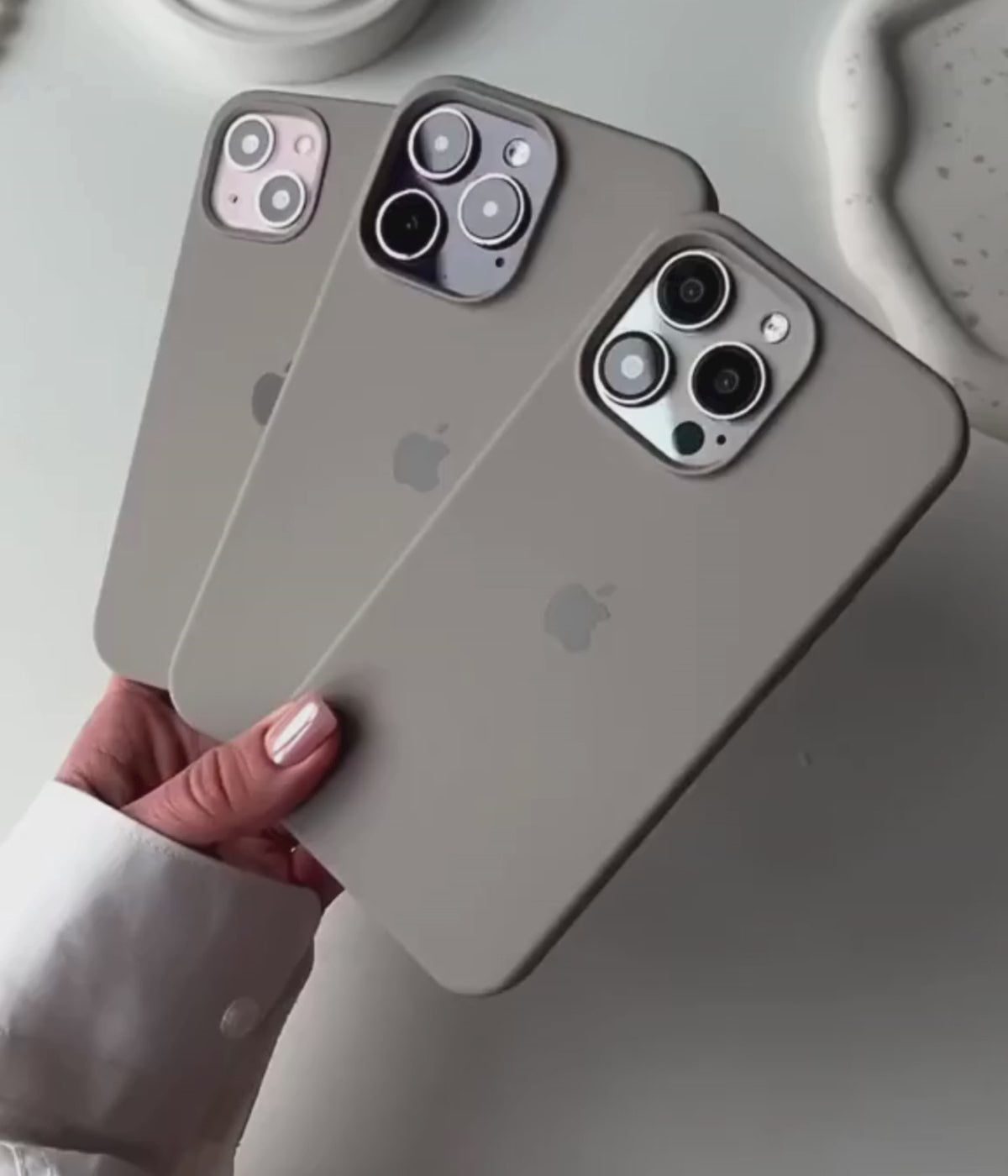 Load video: A video showing a 360-degree view and a close-up of the iPhone graphite grey liquid silicone case