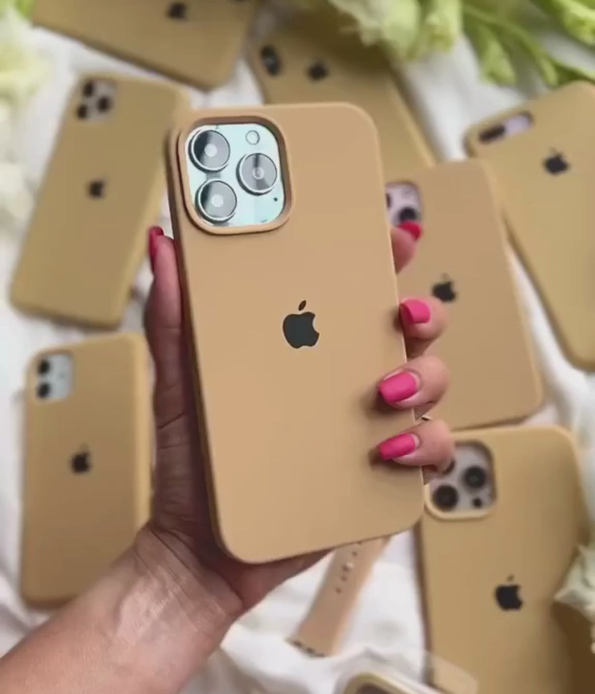 Load video: A video showing a 360-degree view and a close-up of the iPhone mustard yellow liquid silicone case