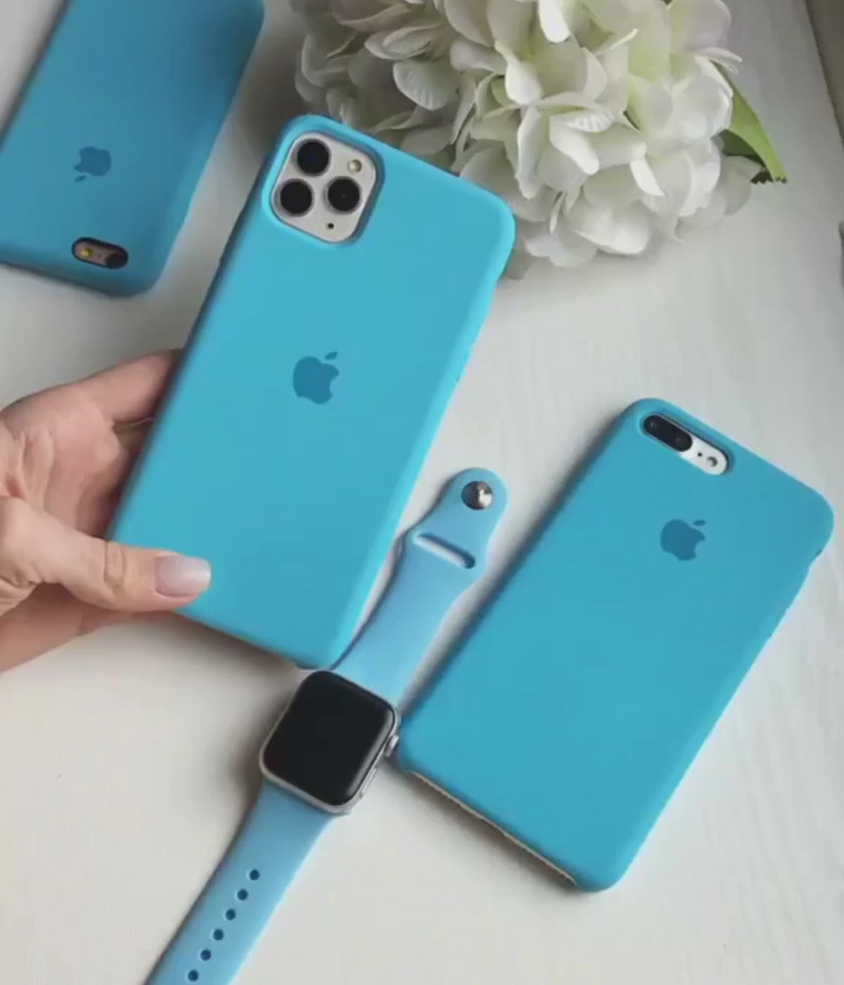 Load video: A video showing a close-up of the iPhone surf blue liquid silicone case