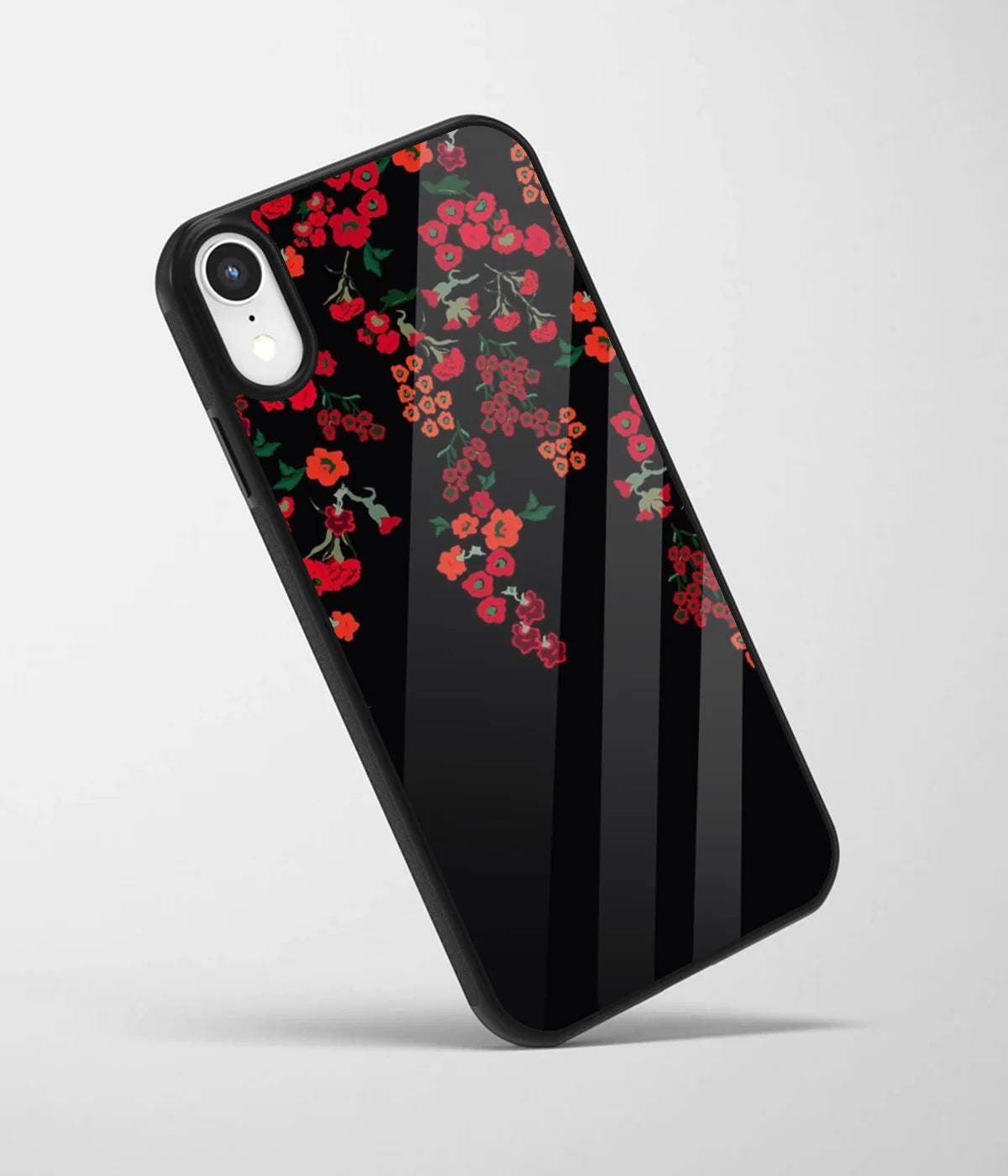 An angled view of a glass phone case featuring a vibrant design.