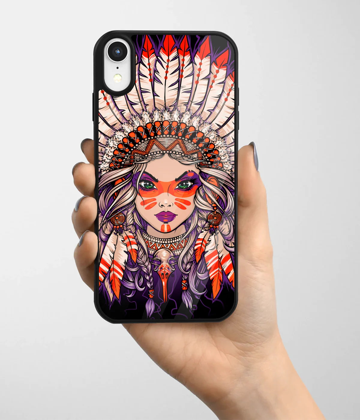A hand holding a glass phone case with a colorful design.