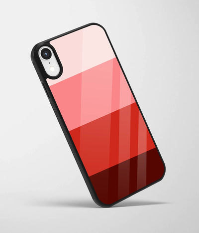 An angled view of a glass phone case featuring a vibrant design.