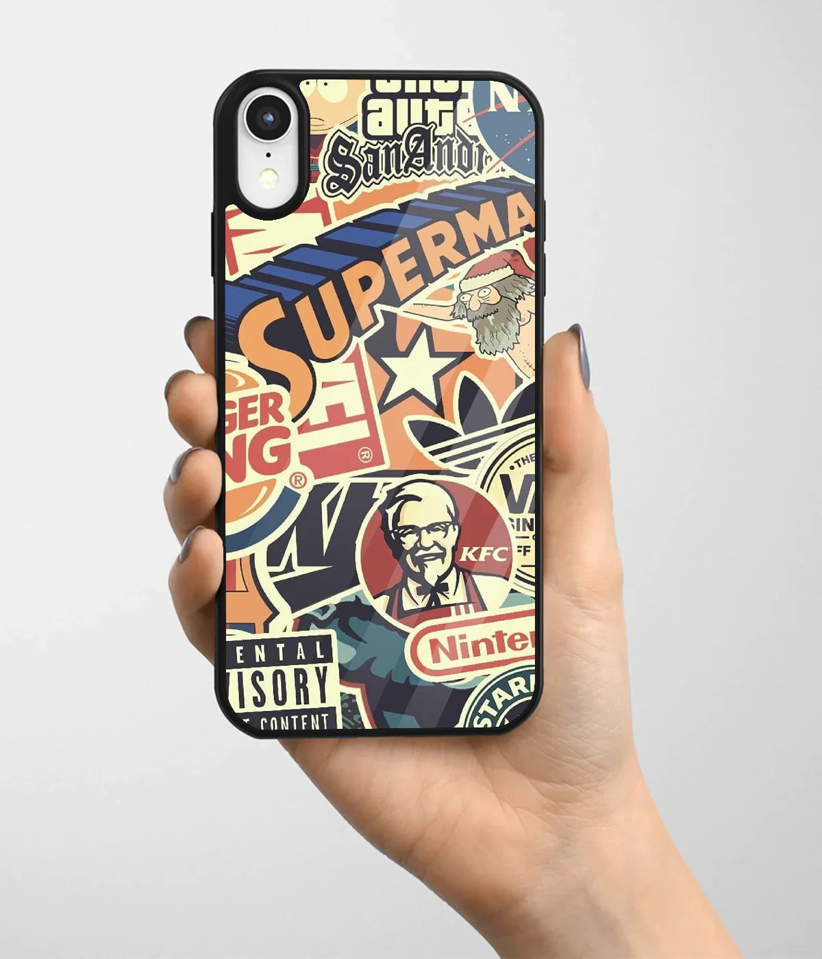 A hand holding a glass phone case with a colorful design.