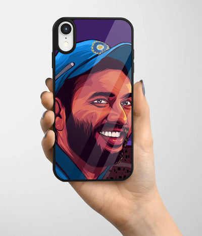 A hand holding a glass phone case with a colorful design.