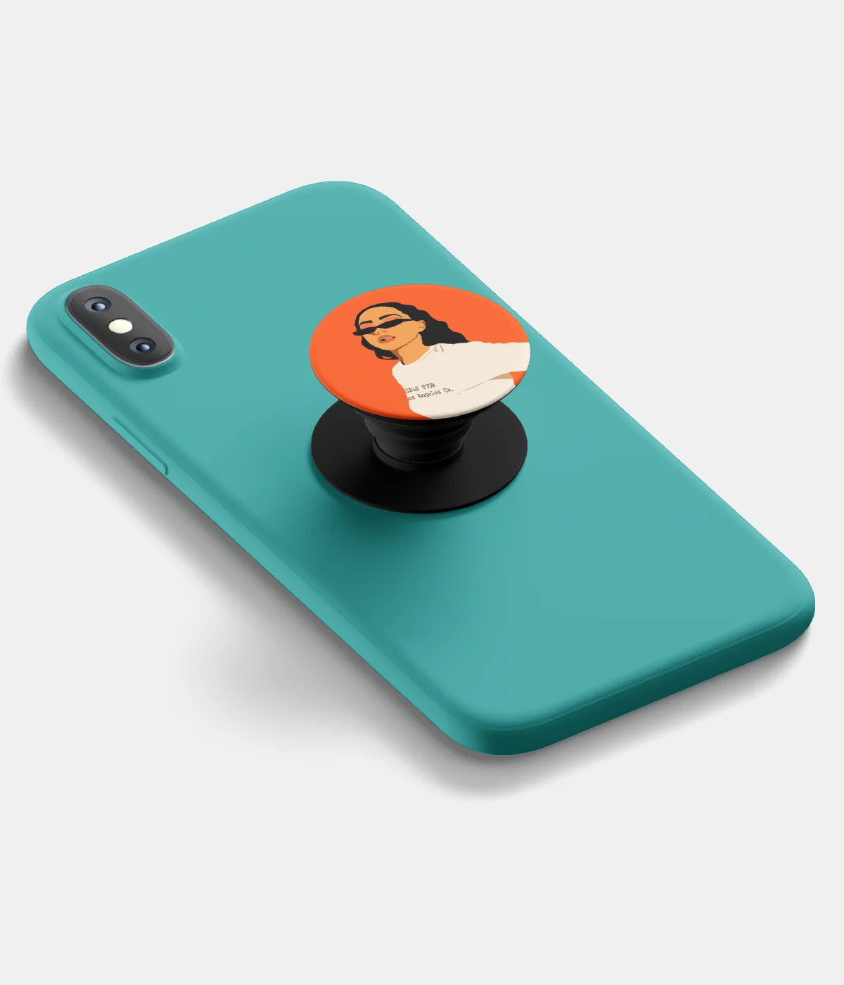 A top-down view of a phone grip holder attached to a mobile phone case on a white background