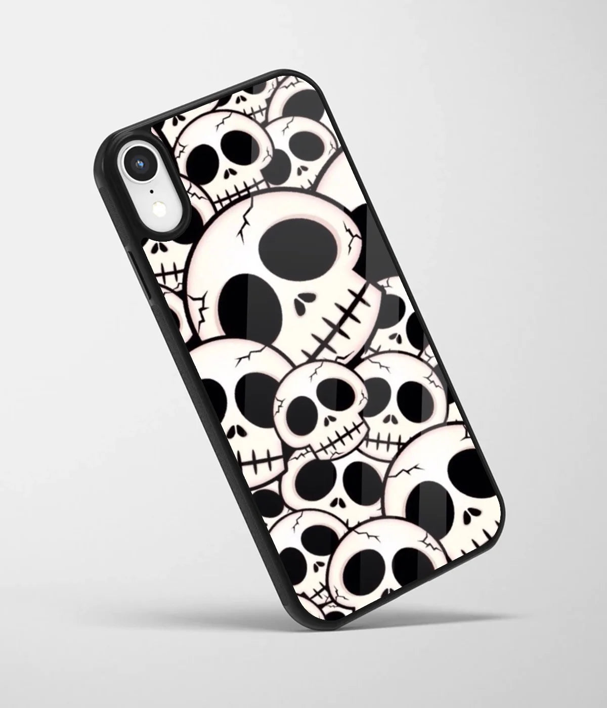 An angled view of a glass phone case featuring a vibrant design.