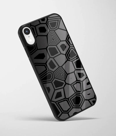 An angled view of a glass phone case featuring a vibrant design.